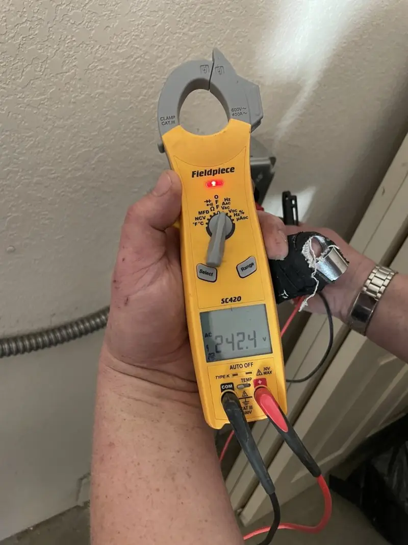 Voltage testing with clamp meter during Electrical Installation Services in The Villages